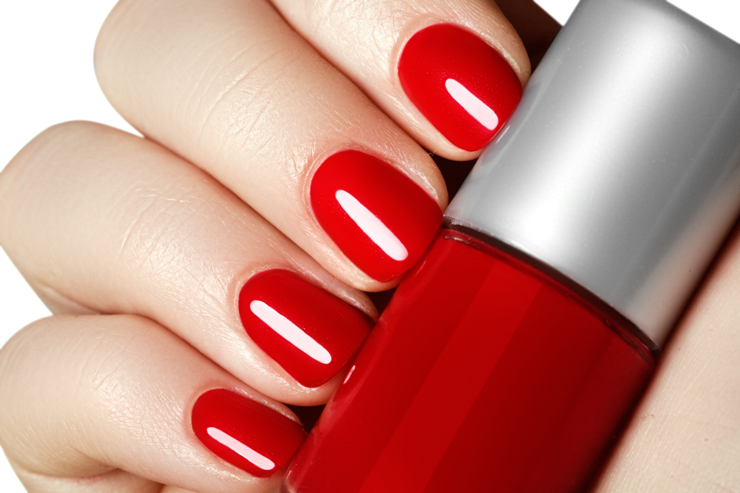 Manicure.,Beautiful,Manicured,Woman's,Hands,With,Red,Nail,Polish.,Bottle